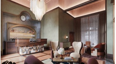 The lobby of The Crawford Hotel with check-in desk and vintage furniture sitting area.