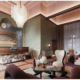 The lobby of The Crawford Hotel with check-in desk and vintage furniture sitting area.
