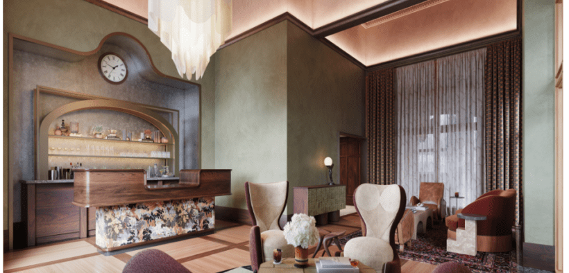 The lobby of The Crawford Hotel with check-in desk and vintage furniture sitting area.