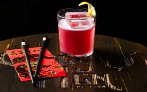 Picture of M.E. Lee's cocktail next to chopsticks.