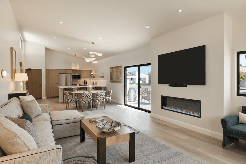 The Living Room at Hilton Scottsdale Resort & Villas with a flat screen TV, couch sitting area and kitchenette.