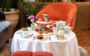 A table at Fairmont Miramar is set with food and tea for a Southern California Mother's Day package.