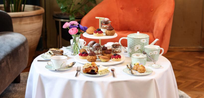 A table at Fairmont Miramar is set with food and tea for a Southern California Mother's Day package.
