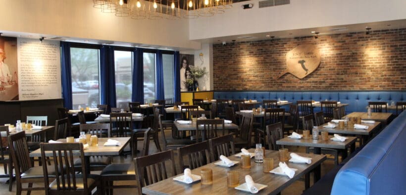 An interior photo of Patricia's Pizza in Scottsdale with booth and center tables.