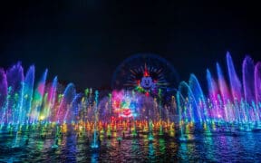 Light projections of Disney's animated movies and colorful fountains rise above Paradise Bay In Disney California Adventure Park for Disneyland Resort 70th Celebration.