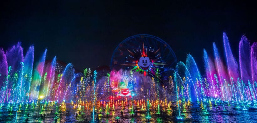 Light projections of Disney's animated movies and colorful fountains rise above Paradise Bay In Disney California Adventure Park for Disneyland Resort 70th Celebration.