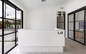 The Med 44 lobby with desk and conference room.