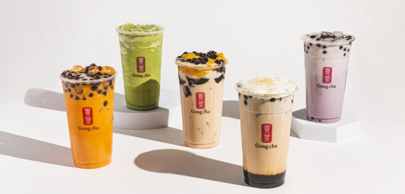 Five flavors of Gong cha bubble tea in large cups, including matcha, coffee and Thai tea flavors.