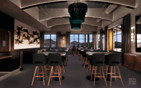 Intimate dining tables with modern chairs and dynamic overhead light installations fill Sparrow restaurant.
