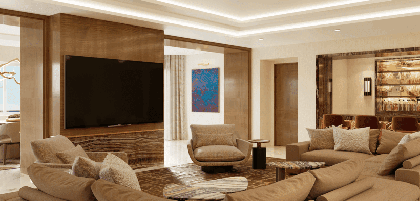 A Strip Suite living room at Green Valley Ranch Resort with family style couch, full bar, TV and views of the Vegas strip.