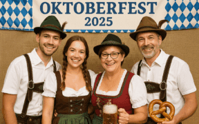 A family wearing traditional German garments pose together in a photo booth for the Fountain Hills Oktoberfest 2025