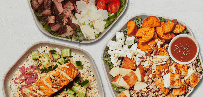 Three bowls from Sweetgreen with salmon, sweet potatoes and steak.