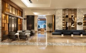 The upgraded lobby of Grand Hyatt San Antonio River Walk with open space and elevated seating and decor.