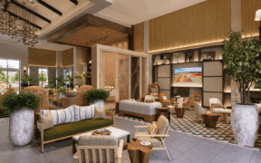 The updated lobby of Hotel Solea with a couch, plants and light-wood accents.