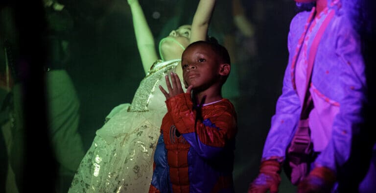 A little boy dressed as Spiderman net to a princess and other costumed child at the Halloween Express Boulder City Event.