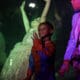 A little boy dressed as Spiderman net to a princess and other costumed child at the Halloween Express Boulder City Event.