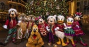 Mickey Mouse, Minnie Mouse and their pals wearing festive outfits in front of a Christmas tree for the Holidays at the Disneyland Resort, in Anaheim, Calif.