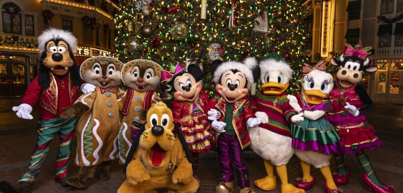 Mickey Mouse, Minnie Mouse and their pals wearing festive outfits in front of a Christmas tree for the Holidays at the Disneyland Resort, in Anaheim, Calif.