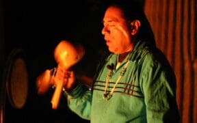 A member of the the Pima (Akimel O'otham) and Maricopa (Pee Posh) peoples plays a native instrument.