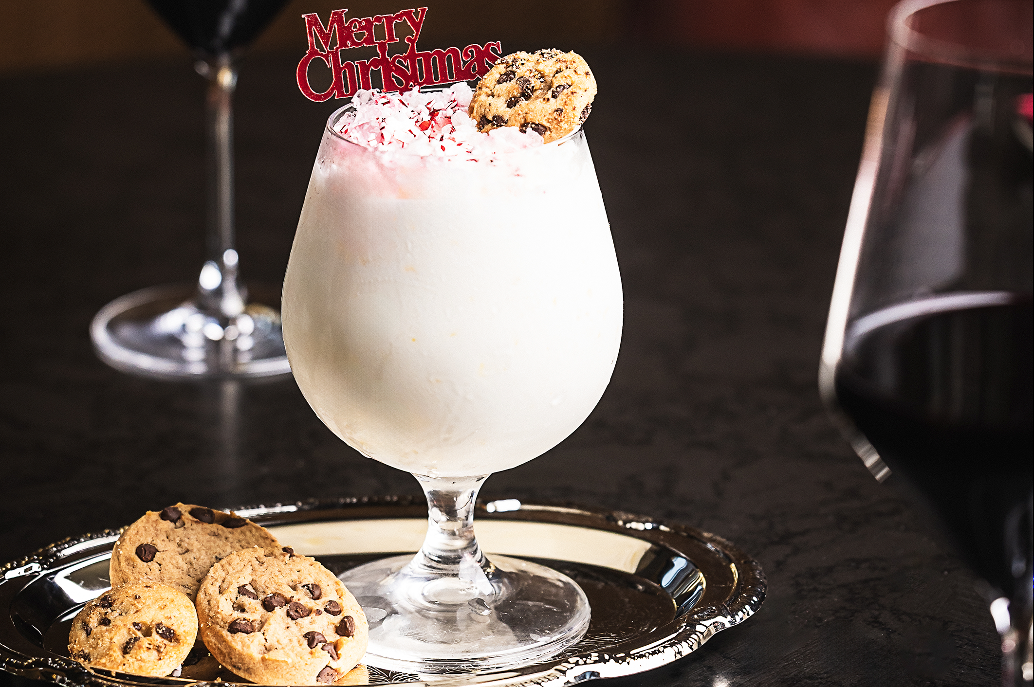 A holiday milkshake with cookies on a silver tray from Gila River Resorts & Casinos Wild Horse Pass.