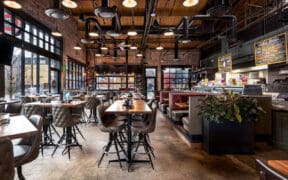 Interior bar and seating with wood accents inside Great Divide Brewery RiNo in Denver.