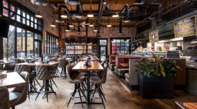 Interior bar and seating with wood accents inside Great Divide Brewery RiNo in Denver.