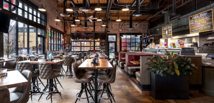 Interior bar and seating with wood accents inside Great Divide Brewery RiNo in Denver.