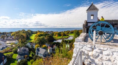 Fort Mackinac Island Fort overlooking the island's city and bay in the background.