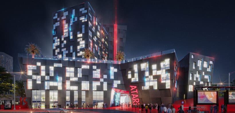 A rendering of the outside of the new Phoenix Atari Hotel coming in 2026 lit up at night.