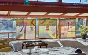 Three outdoor hanging panels in the Desert Mirror art display at Taliesin West.