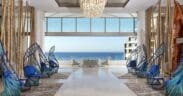 Open-air lobby at Garza Blanca Resort & Spa Los Cabos with ocean views and modern coastal design