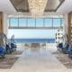 Open-air lobby at Garza Blanca Resort & Spa Los Cabos with ocean views and modern coastal design