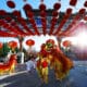 Lion dance performers beneath red lanterns during a Lunar New Year celebration at Ling & Louie’s Scottsdale.