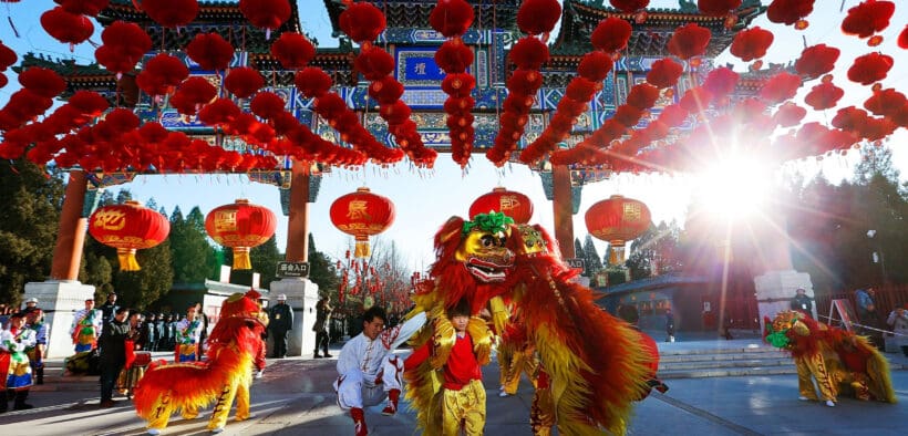 Lion dance performers beneath red lanterns during a Lunar New Year celebration at Ling & Louie’s Scottsdale.