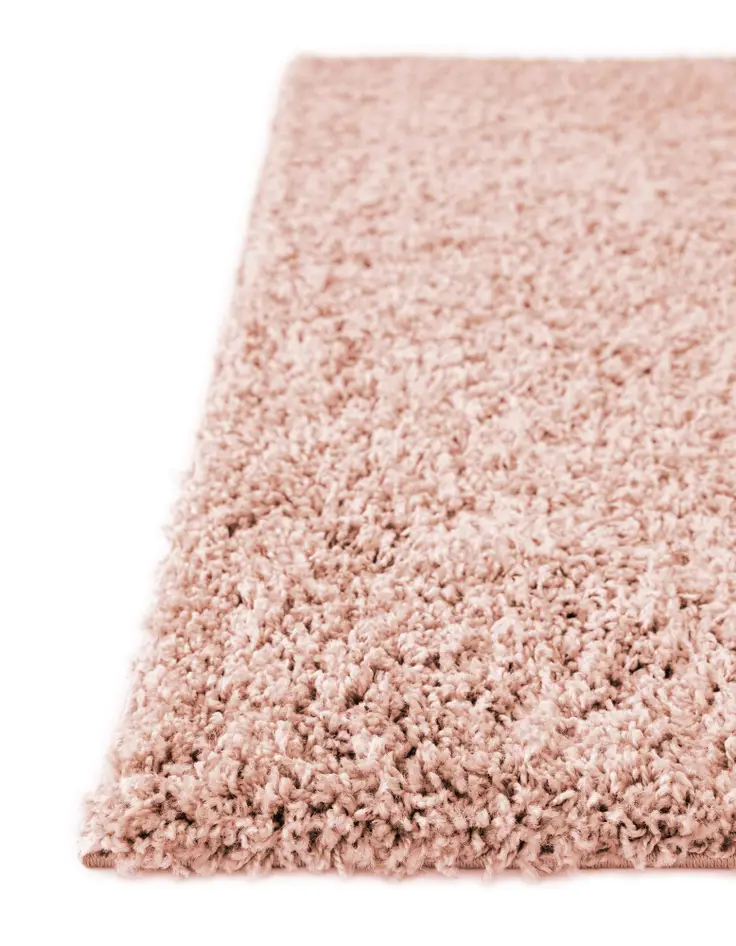 Rose pink shag runner rug with plush texture by Rugs.com, shown in a close-up view highlighting its soft, dense pile.