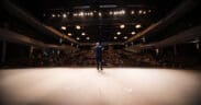 A man on a stage of a theatre during the Sedona International Film Festival.