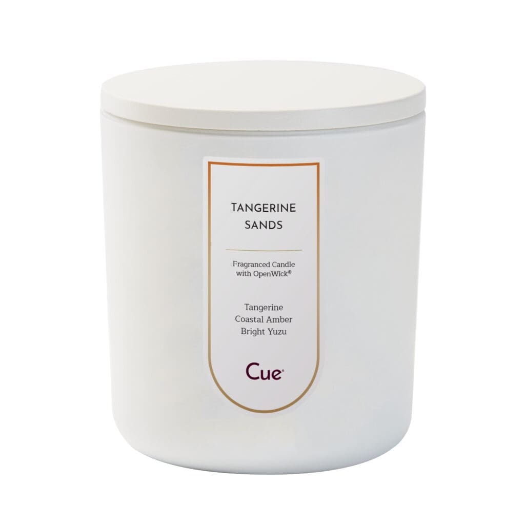 Tangerine Sands fragranced candle by Cue, displayed in a sleek white container with notes of tangerine, coastal amber and bright yuzu.