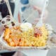 Asian street food dish with ramen, egg, fries and panda decal, served by a vendor at Panda Fest in Phoenix