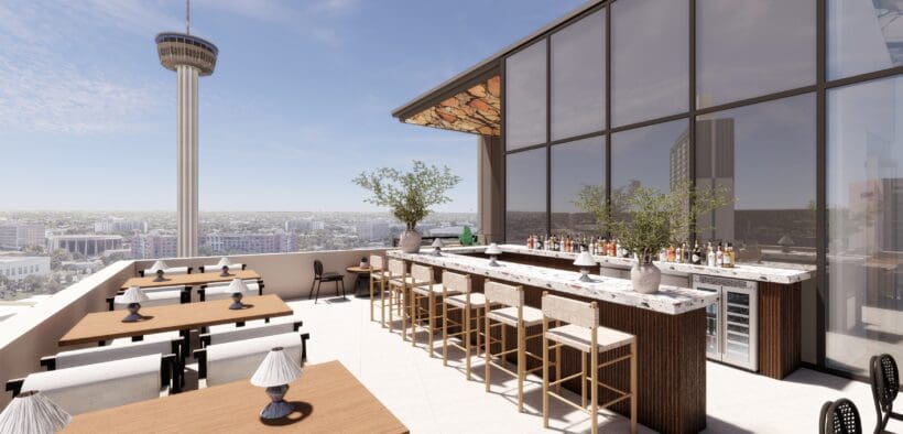 Rooftop bar and dining terrace at Aleteo at The Monarch San Antonio, featuring city views, modern seating and an open-air bar overlooking downtown.