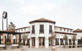 Exterior of Magnolia Table restaurant founded by Chip and Joanna Gaines in Waco, Texas.