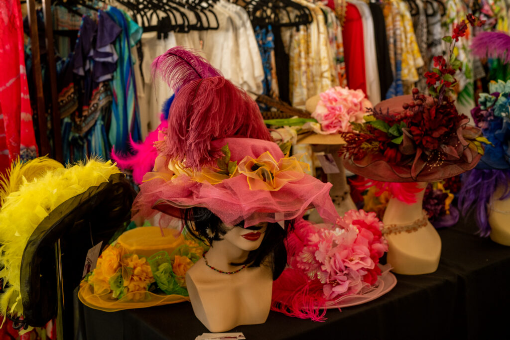 Display of colorful Derby hats and fashion accessories at Kentucky Derby party Arizona highlighting Derby style and event shopping experience.