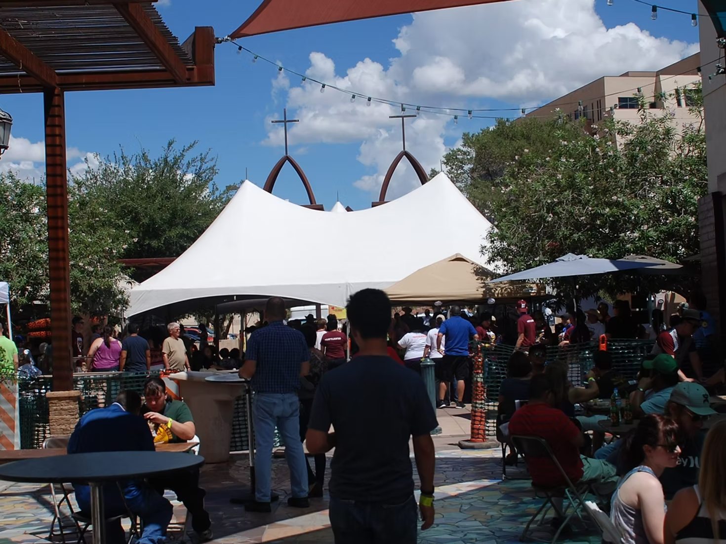 Outdoor market in Las Cruces, New Mexico with local vendors, handmade goods and crowds browsing during Easter weekend.