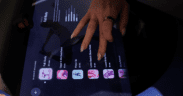 Close-up of a guest selecting massage settings on a digital screen for an AI-powered robotic massage at Spa by JW Austin.