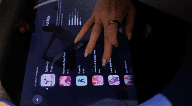 Close-up of a guest selecting massage settings on a digital screen for an AI-powered robotic massage at Spa by JW Austin.