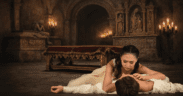 Ballet Arizona Romeo and Juliet performance with dancers in dramatic candlelit scene inside a cathedral-style set in Phoenix.