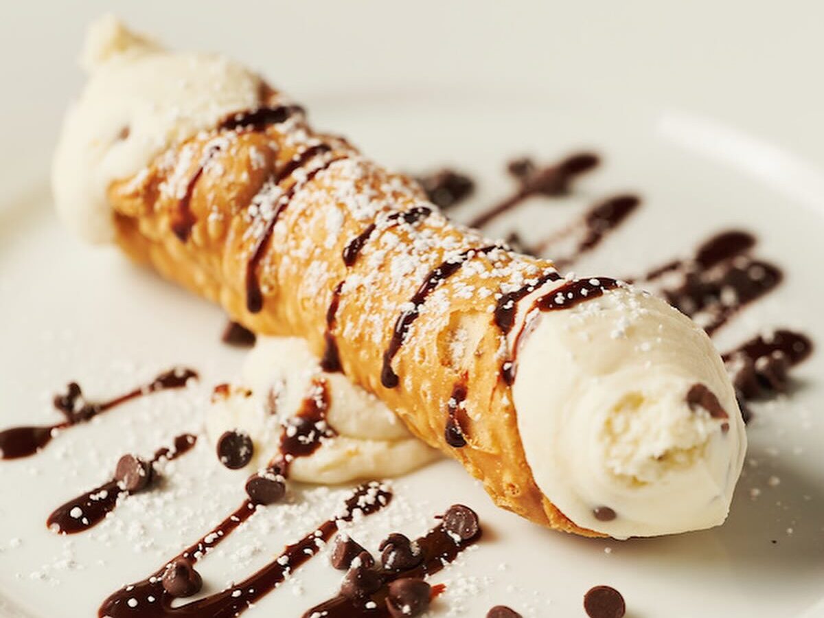 A canoli from Brody's Italian in Paradise Valley, drizzled with chocolate and powdered sugar.