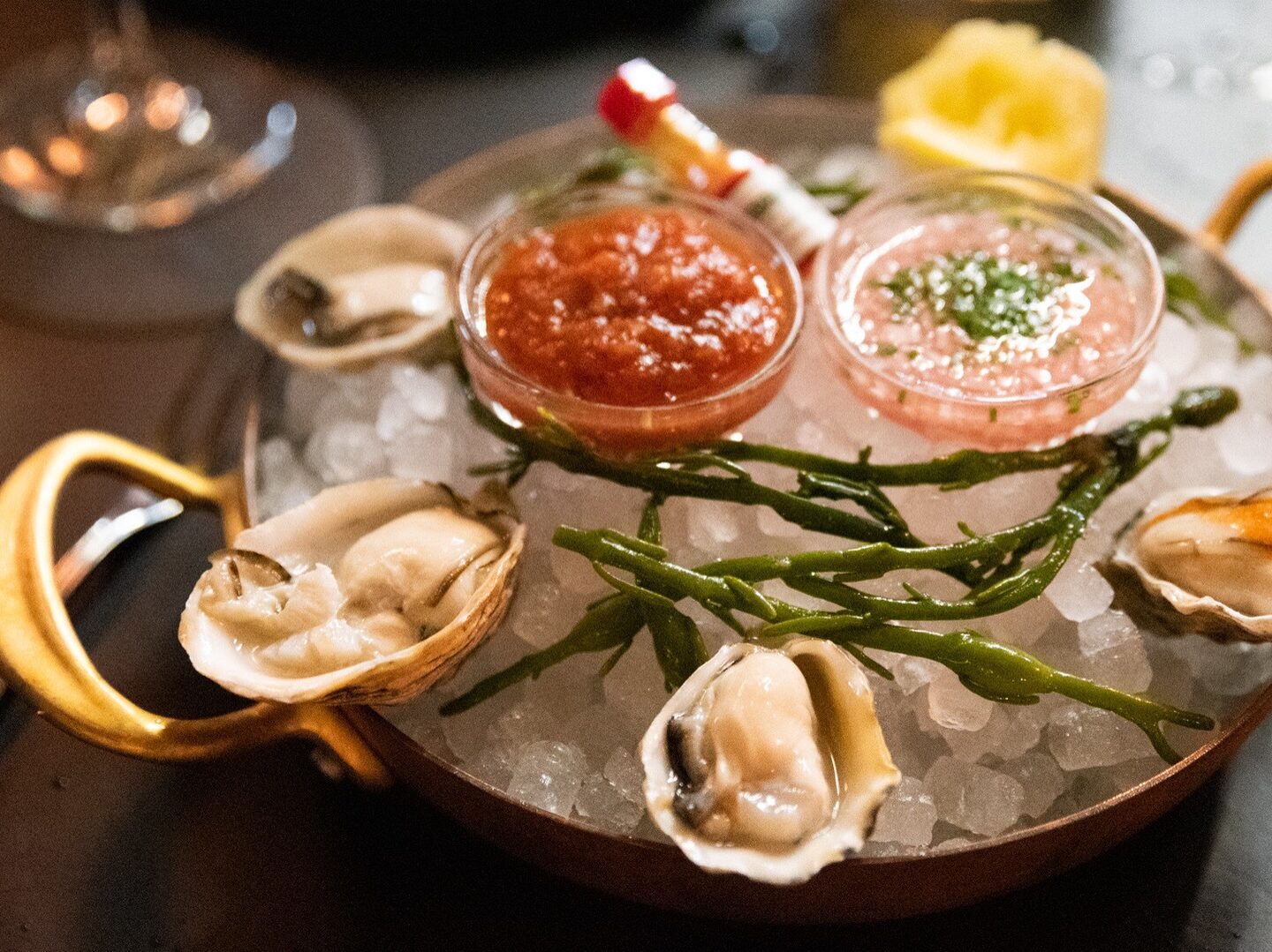 Oysters on ice with sauces and seafood accompaniments at Maple & Ash in Scottsdale.