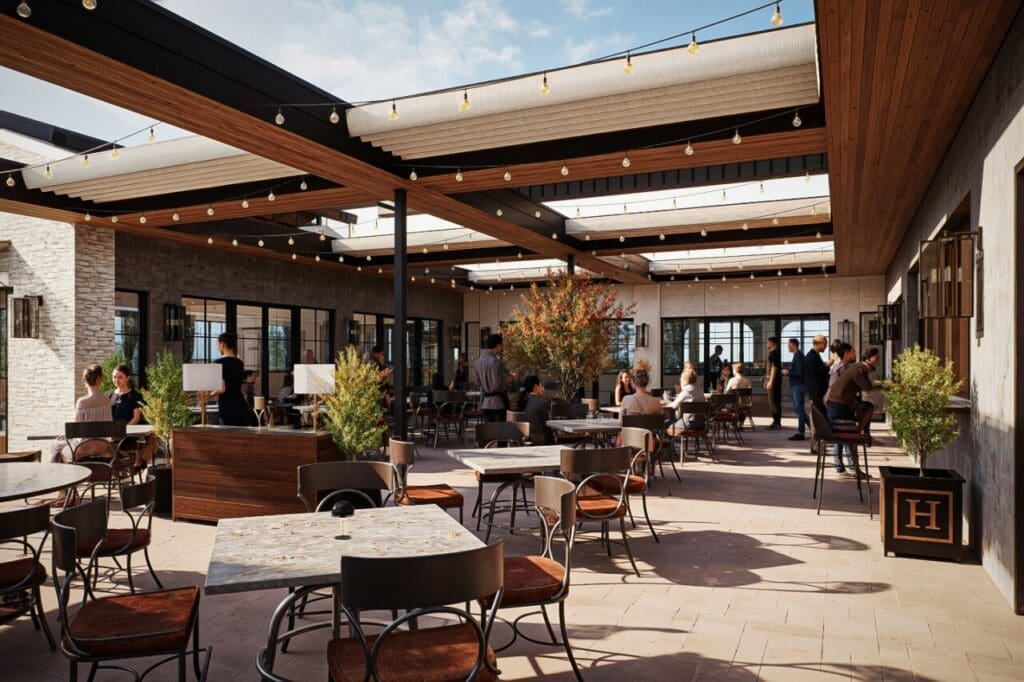 Outdoor patio dining at The Henry with string lights, tables and guests enjoying brunch.