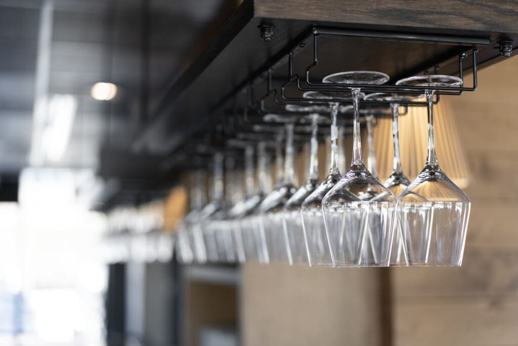 Hanging wine glasses at Odd Rabbit restaurant bar in Boulder.