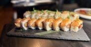 The Akira roll at Across the Pond combines spicy salmon, tamarind sauce and a garlic crumble.